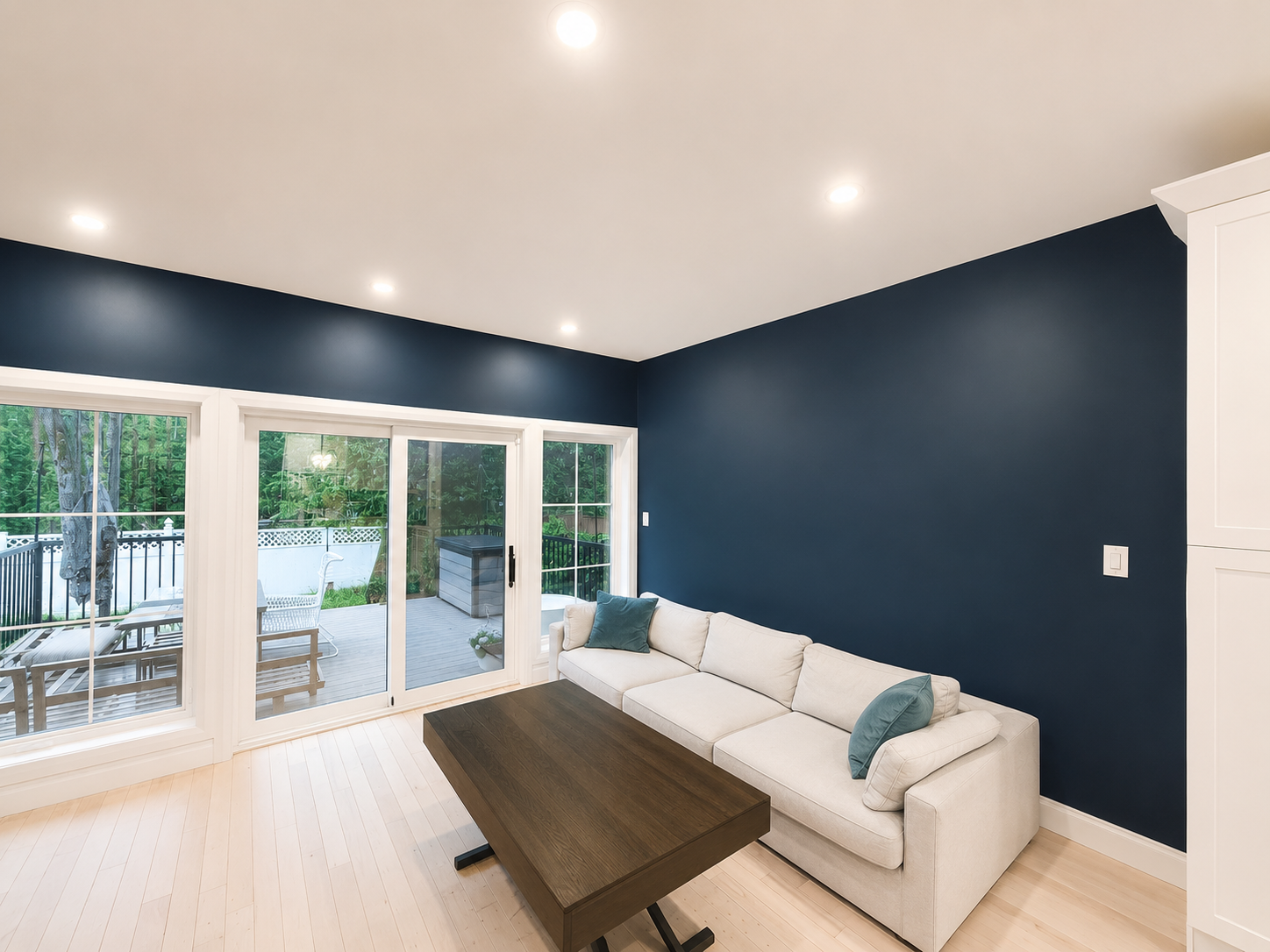 Professional interior painting — navy accent wall living room Ottawa